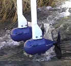Aquair hydro generators in an irrigation ditch supplement PV power at the Roe home.
