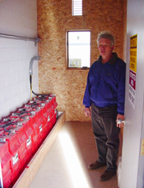 Gene Gudmundson built a special room to house batteries to store power, even though his system is net metered.